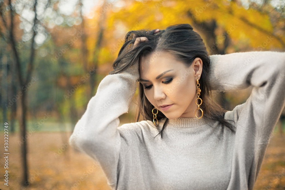 Cute young mixed race woman fashion autumn clothing gray sweater in autumn outdoor. Cute young mixed race woman fashion autumn clothing gray sweater in autumn outdoor.