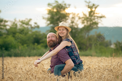 Loving couple in a wheat field. © erika8213