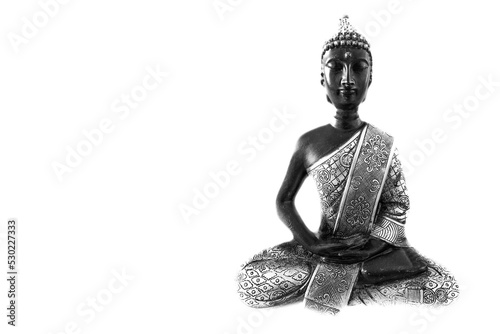 Meditating Buddha Statue isolated on white background. White space on the left hand side.