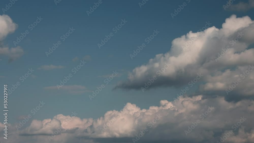 Timelapse of cumulus clouds moving in the blue sky. Light clouds change their shape in cloud space. Timelapse of cumulus clouds moving in the blue sky. Light clouds change their shape in cloud space.