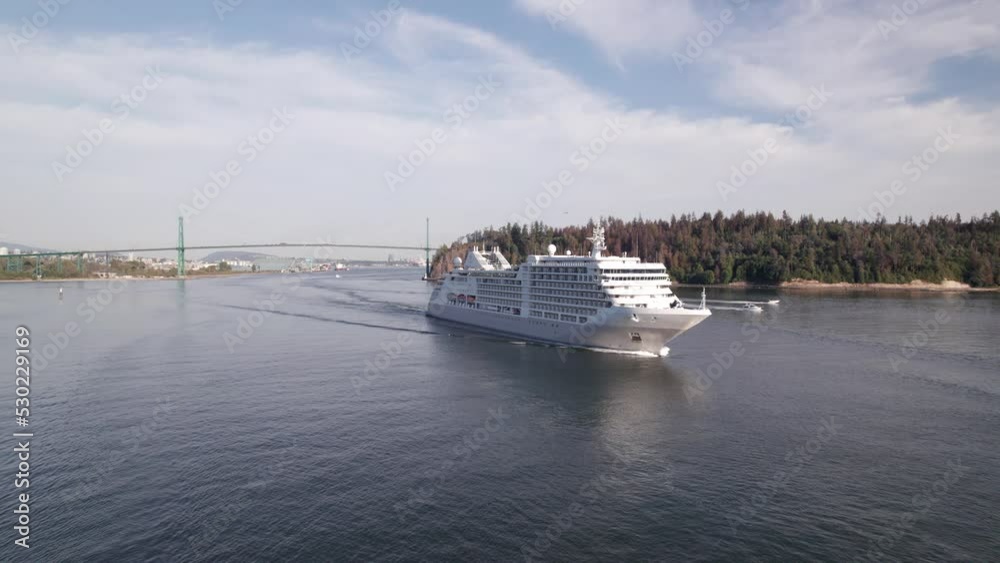 Cruise ship sailing out of Vancouver harbour at sunset, cruise line, large boat, luxury cruise, aerial footage. 4K 4096x2304 PRORES 24FPS. Cruise ship sailing out of Vancouver harbour at sunset, cruise line, large boat, luxury cruise, aerial footage. 4K 4096x2304 PRORES 24FPS.