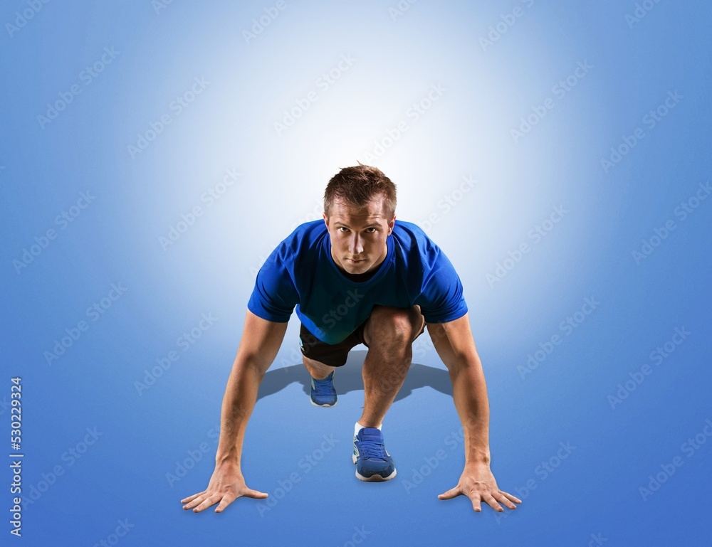 Athletic male runner on the start. Sports concept. Athletic male runner on the start. Sports concept.