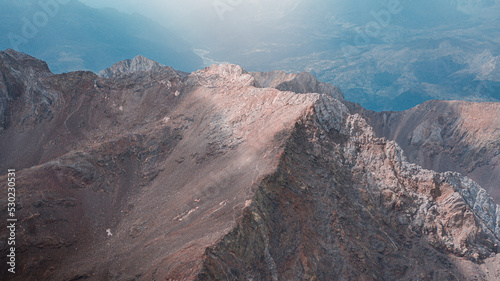 Aerial photography made with a drone over the peak of Hell in the Pyrenees in Aragon, Spain, a sea of ​​spectacular mountains. 