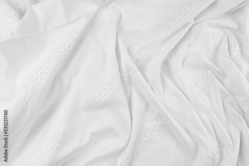 White fabric. luxurious white fabric texture background. Creases of satin, silk, and cotton..