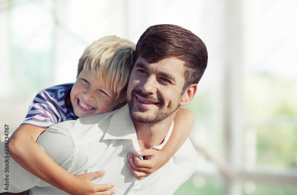 Happy father with child playing at home living room. Happy father with child playing at home living room.
