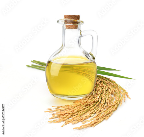 Rice bran oil with rice ears and leaves  isolated on white background.