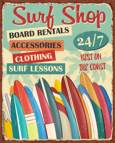 Surf Board Shop vintage metal sign with surfboard lines up on  beach.