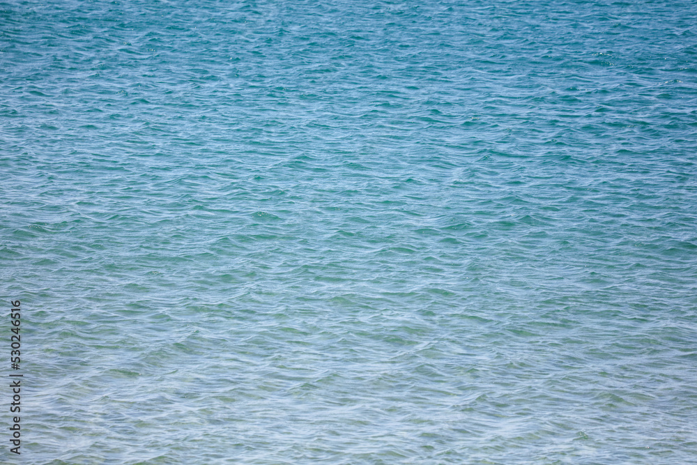 Obraz premium Blue water in the sea as an abstract background.