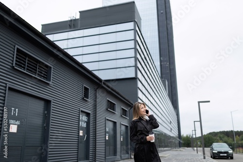 successful business woman hurries to do business next to the office building © Ivan Traimak