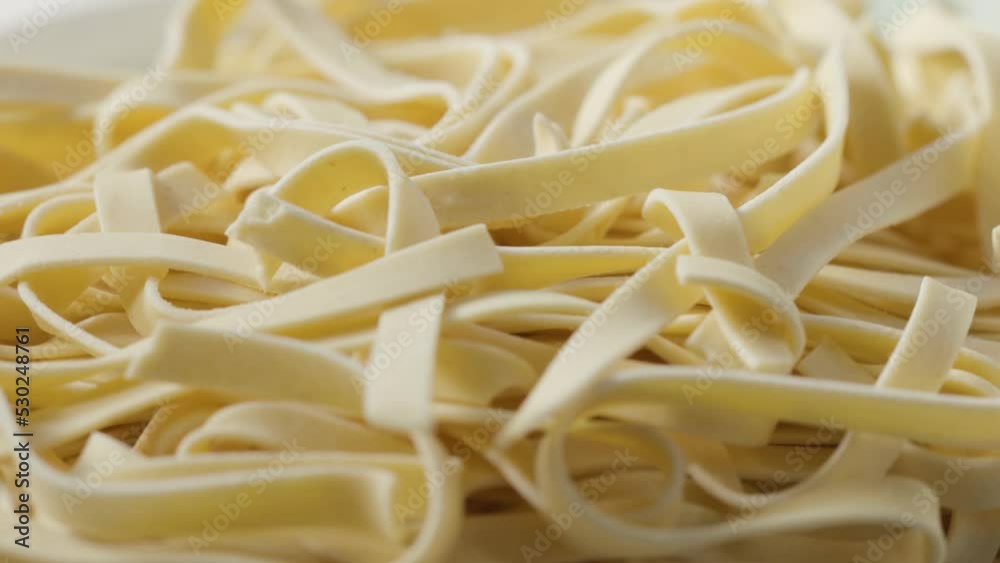 a bunch of raw pasta spins in a circle a bunch of raw pasta spins in a circle