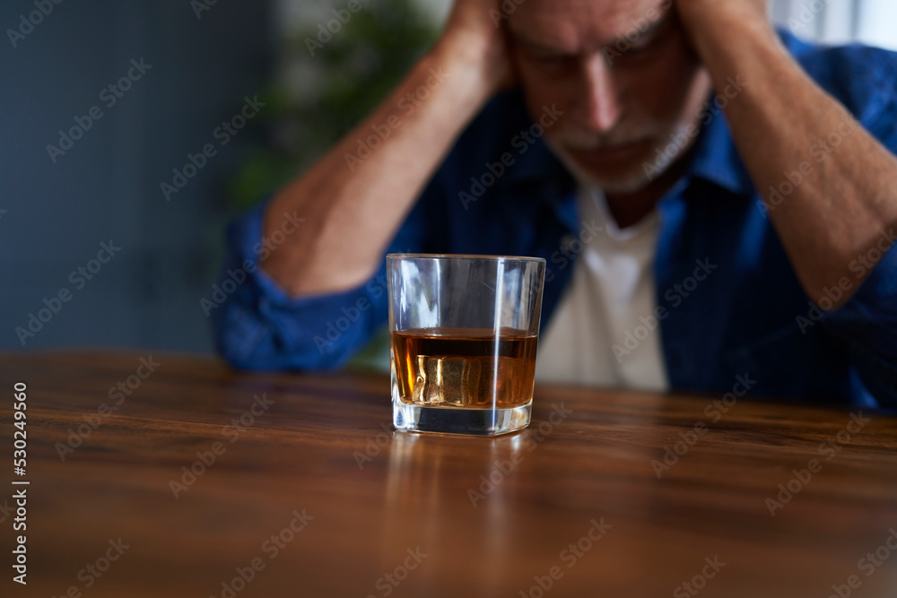 Senior caucasian man with alcohol problem
