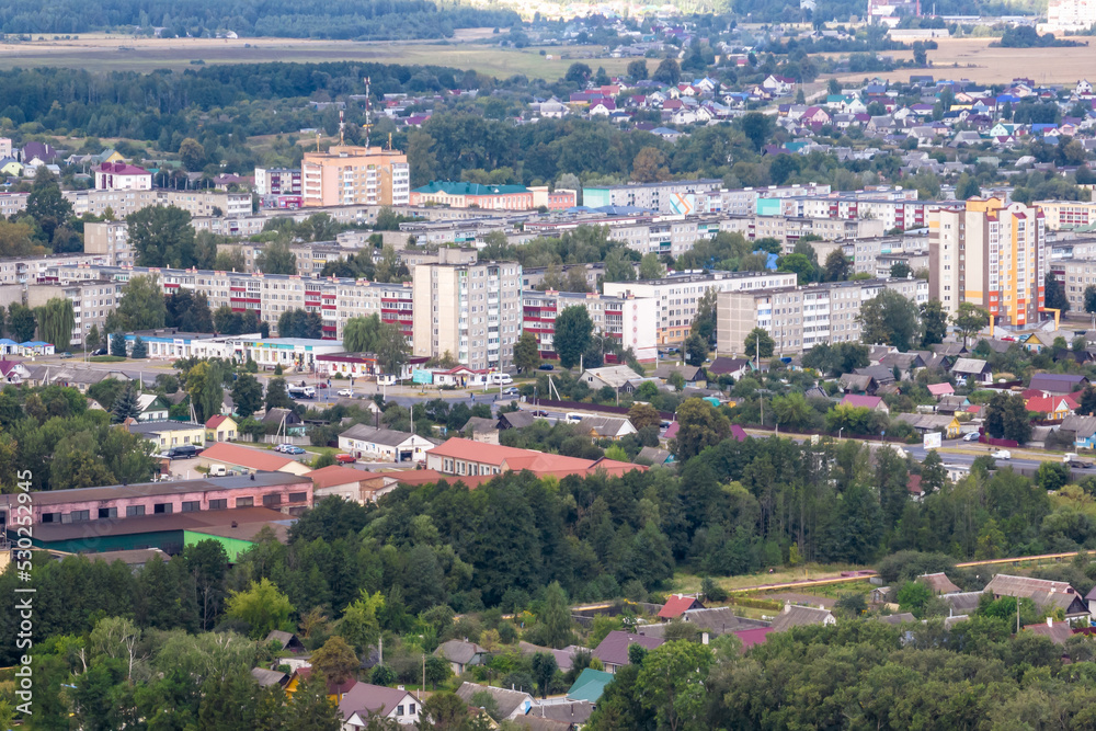 aerial panoramic view from a great height of a small provincial town with a private sector and high-rise apartment buildings