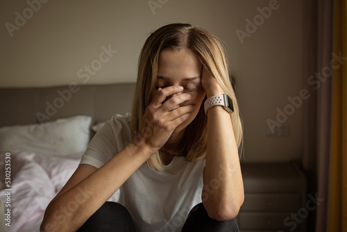Tired Mother Suffering from experiencing postnatal depression. Health care mom motherhood stressful. Stay home during coronavirus covid-19 pandemic quarantine