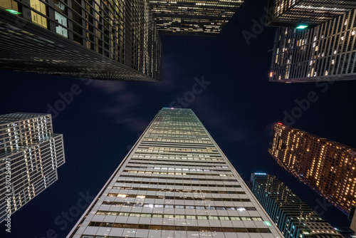 Toronto skycrapers from below looking up with long exposure clouds blurred