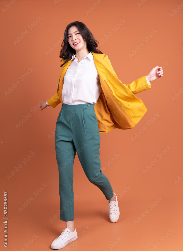 Full length photo of young Asian woman on background Stock Photo ...