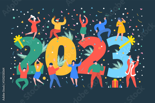 New Year party concept. Business people dance next to numbers 2023. Preparing to meet the new year.