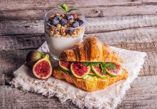 Obraz na płótnie Delicious homemade breakfast with yogurt and croissant. Croissant with figs. Good morning concept w salonie