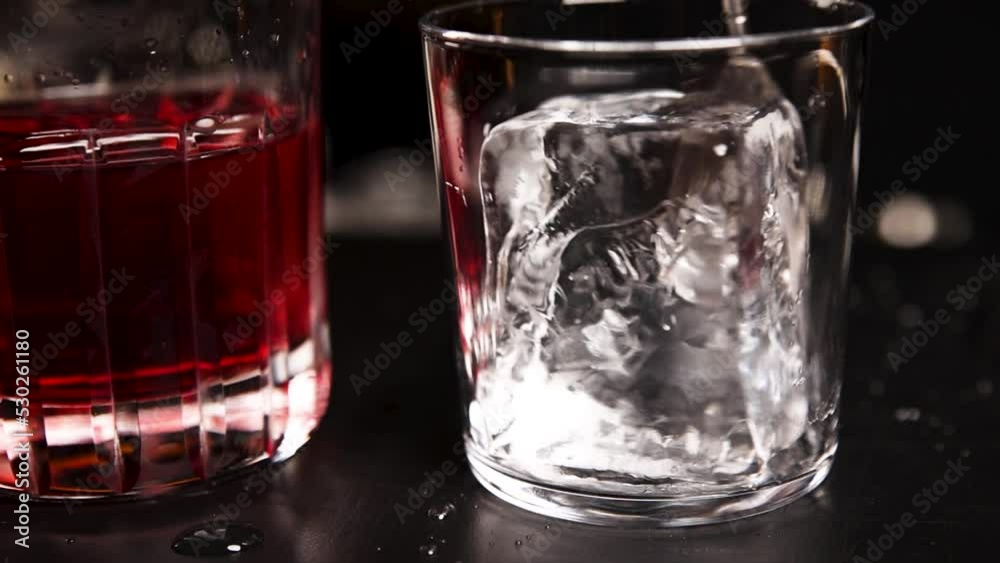 the bartender prepares a cocktail at the bar