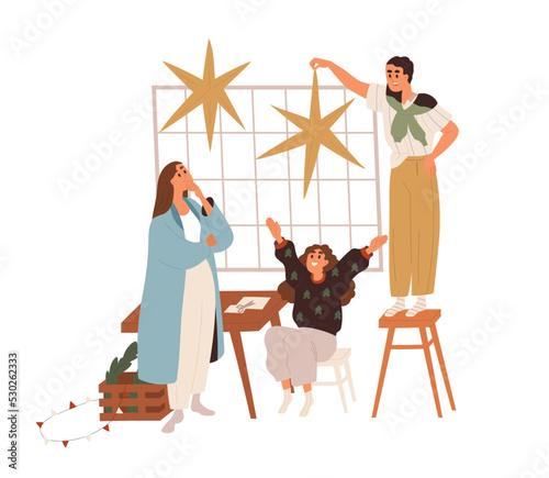 Happy family decorating home for Christmas. Mother, father and daughter child...