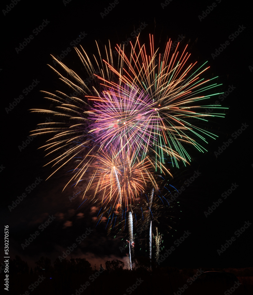 Fireworks of different colors with the black background
