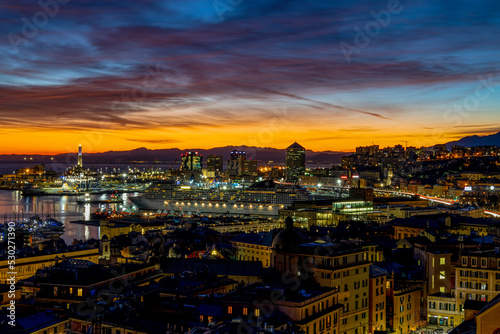 GENOA, ITALY, JANUARY 28, 2022 - View of the port of Genoa at sunset, Italy. © faber121