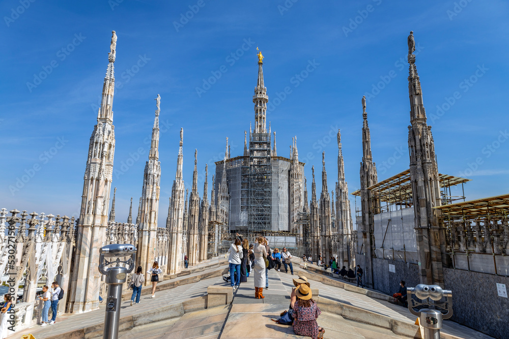 Naklejka premium MILAN, ITALY, MARCH 5, 2022 - The roof terrace of Milan Duomo Cathedral in central Milan Italy
