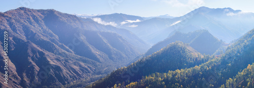 Mountain landscape with deep gorge, morning light, panoramic view
