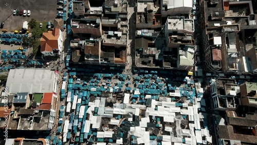 City Landmark In The Heart Of Otavalo With Mercado de Ponchos In Ecuador. Aerial Tilt-up