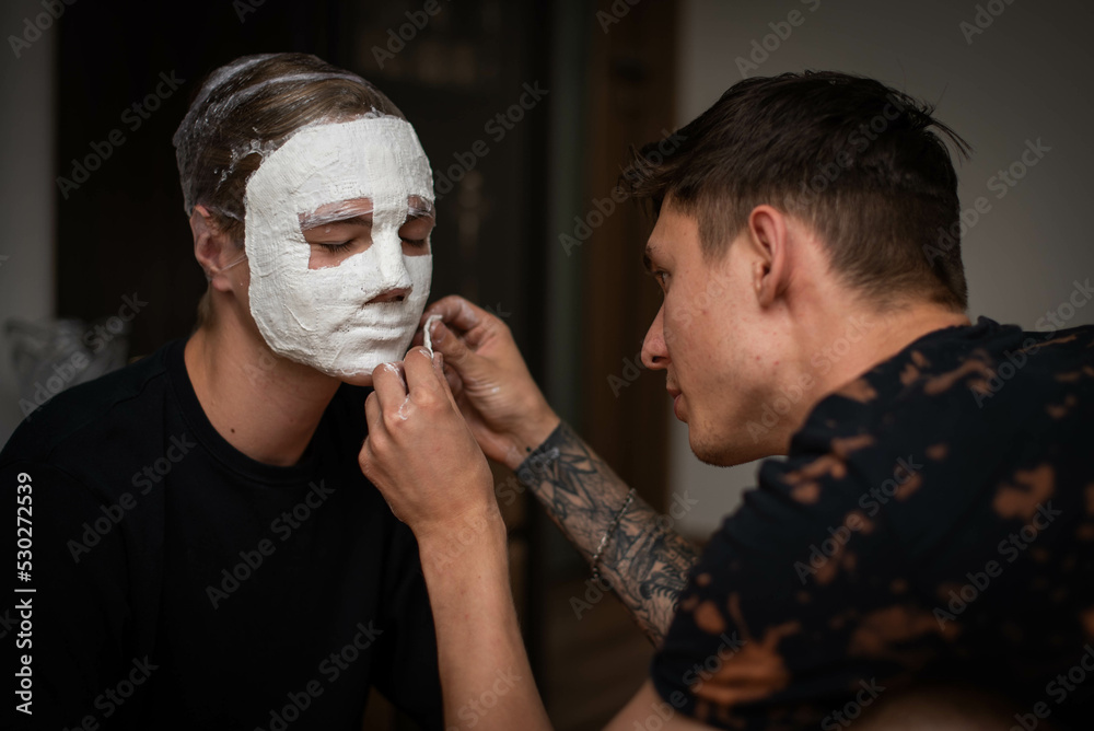 The process of making a plaster mask at home. creating masks based on a  plaster cast. Gypsum mold. Cast of the face. Sculpting. The workflow of the  artist. Stock Photo | Adobe