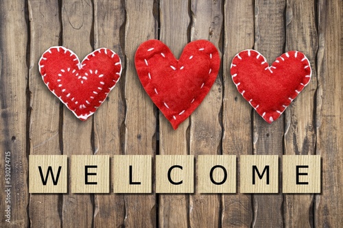 Vászonkép Heart and wooden blocks with WELCOME word
