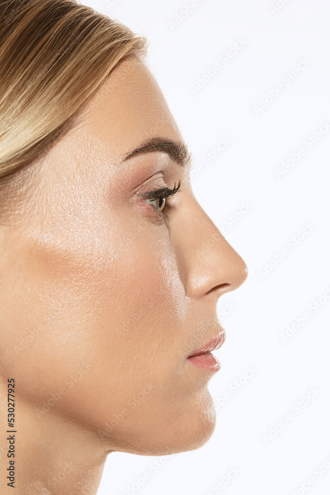 Profile view of beautiful young woman on white studio background. Concept of cosmetics, makeup, natural and eco treatment, skin care. Right side Profile view of beautiful young woman on white studio background. Concept of cosmetics, makeup, natural and eco treatment, skin care. Right side