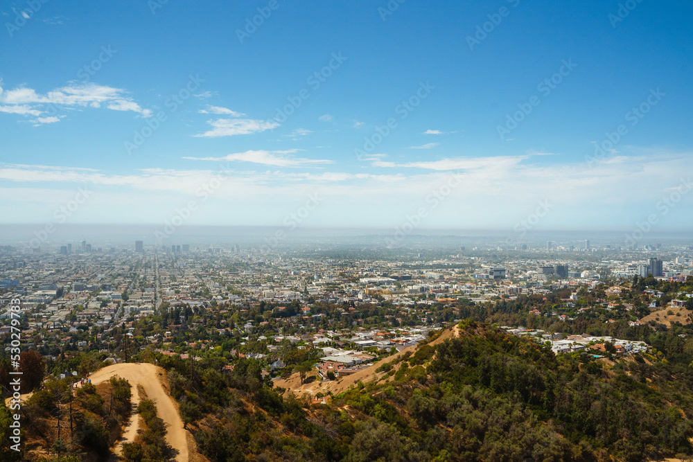 Los Angeles panorama from Hollywood Mount hiking trail. Bright sunny day in California Koreatown