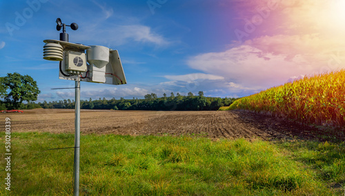 Modern and digital agriculture with a weather station when the weather is nice. photo