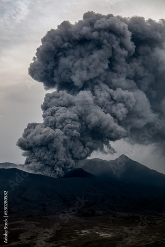 Smoke and ash erupting from Mt Bromo summit Fototapeta
