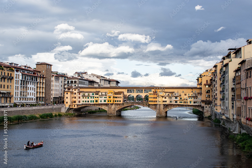 Ponte Vecchio old Bridge in Florence, Tuscany, Italy. Medieval stone bridge that spans river Arno.