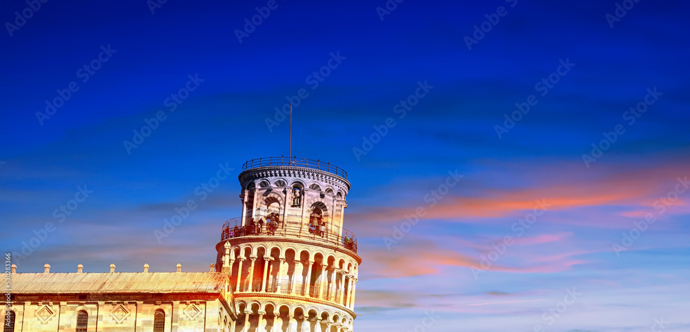 The sunset sky scene in Pisa Cathedral (Duomo di Pisa) with Leaning Tower  (Torre di Pisa) Tuscany, Italy.The Leaning Tower of Pisa is one of the main landmark in Italy.