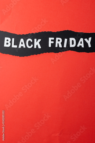 Composition of pink paper cards and black friday text on gray background