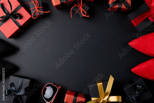 Composition of shoes and presents with copy space on gray background