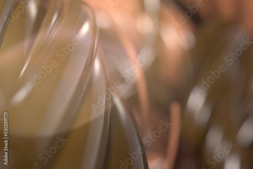 Blurred abstract background from twisted flows of thick chocolate liquid. Template with empty space for text on the topic of cooking and sweets