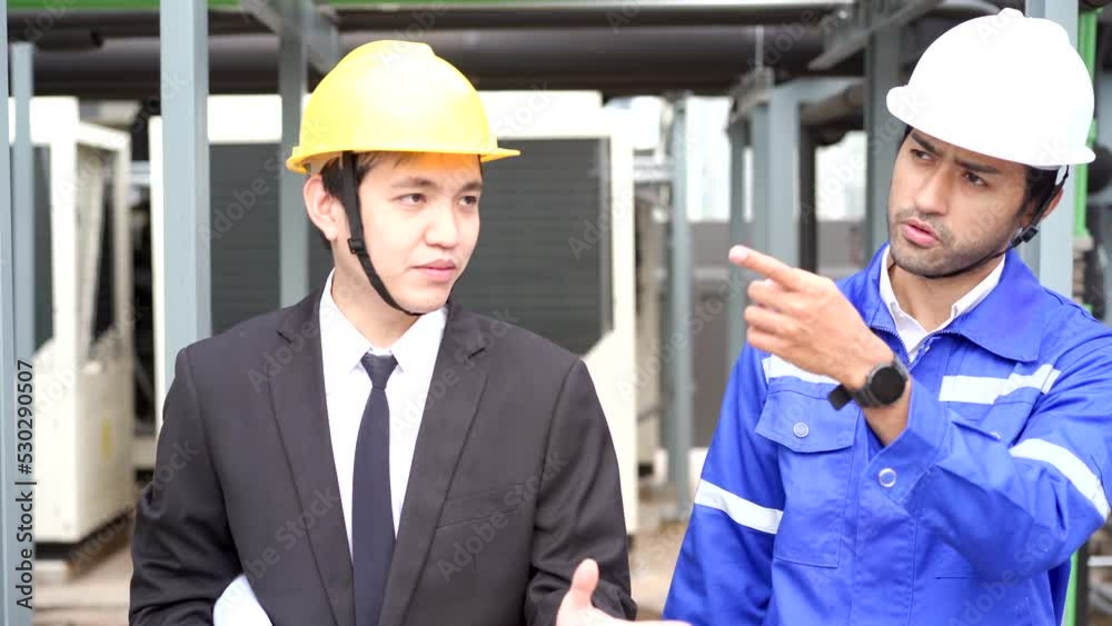 Asian businessman or project manager discussing with foreman or engineer. Asian businessman or project manager discussing with foreman or engineer.