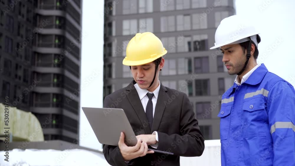 Asian businessman or project manager discussing with foreman or engineer. Asian businessman or project manager discussing with foreman or engineer.