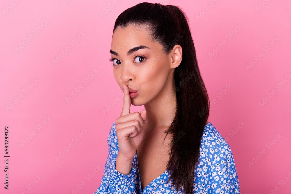 Photo of cute brunette young lady finger mouth wear blue blouse isolated on pink color background