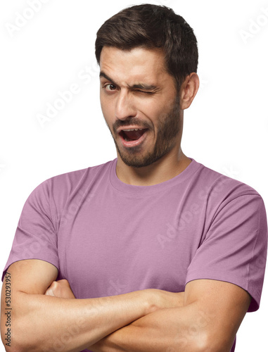 Studio shot of young man winking while flirting