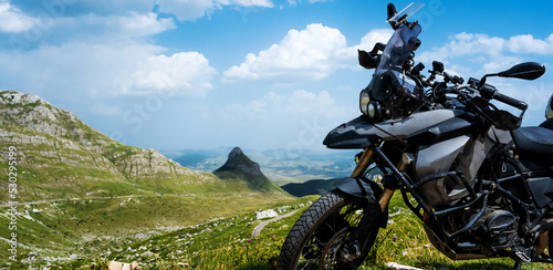 Fototapeta Motocycle bike in the mountains in National park Durmitor in Montenegro with ama