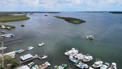 Aerial southern flight over local fishing boats and the southern looking view from Bradenton, Florida of Sarasota Bay photo