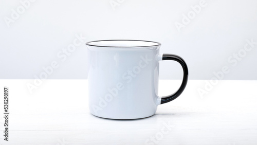 White rustic cup with black elements on white background. Mug for hot beverage drinks with simple design