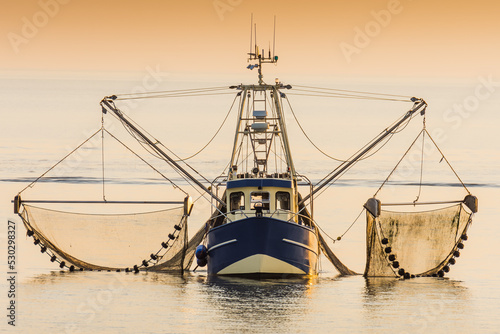 Fishing boat on the North Sea fishes with a trawl net, Schleswig-Holstein, Germany