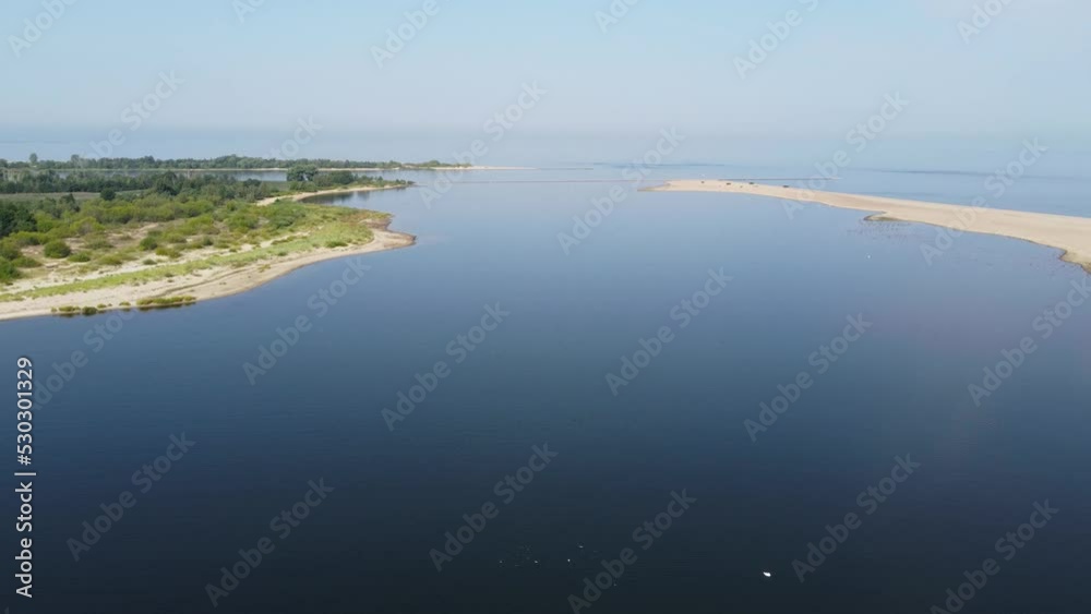 Aerial view on Mikoszewo Beach and the mouth of the Vistula River to the sea in background.