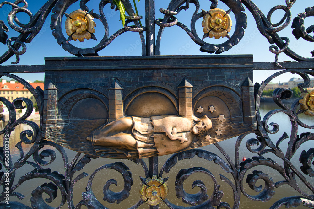 Φωτογραφία A detail view of iron forged grid with Saint John of Nepomuk relief on Charles Bridge in Prague, Czech Republic