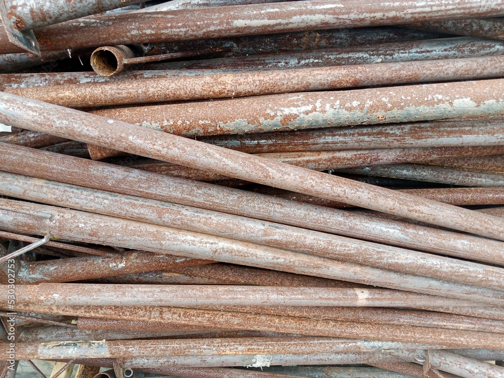 pile of rusty iron pipes